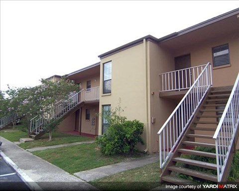 an apartment building with two sets of stairs
