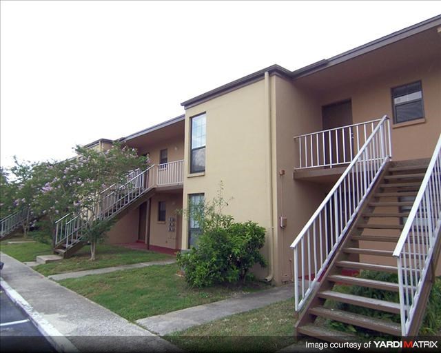 an apartment building with two sets of stairs