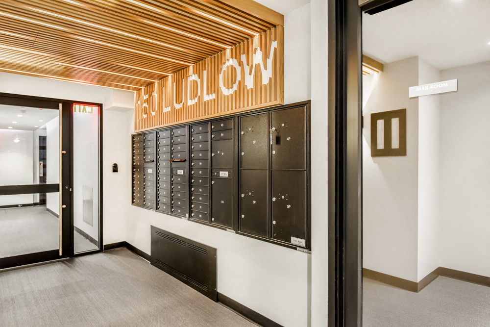 a view of the locker room in the hall of a building with the door open