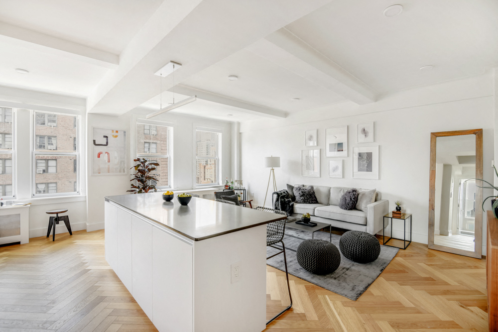 a living area with a kitchen and a living room