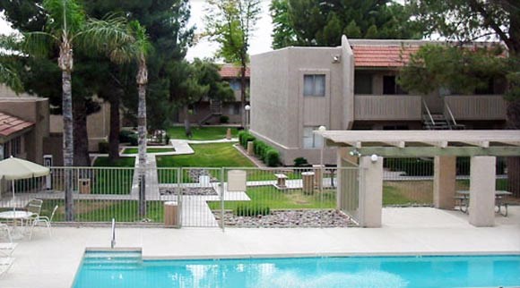 a swimming pool in the backyard of a house