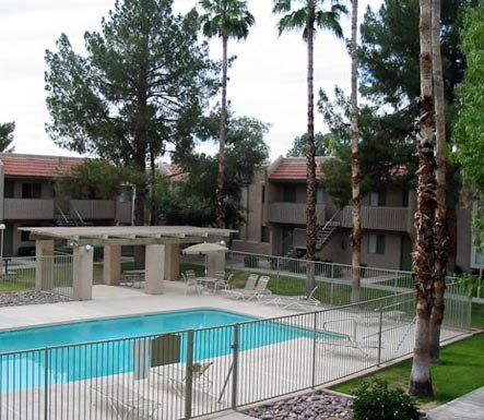 a swimming pool with a fence around it