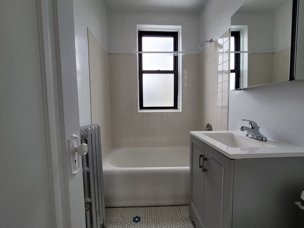 a bathroom with a sink and a bath tub