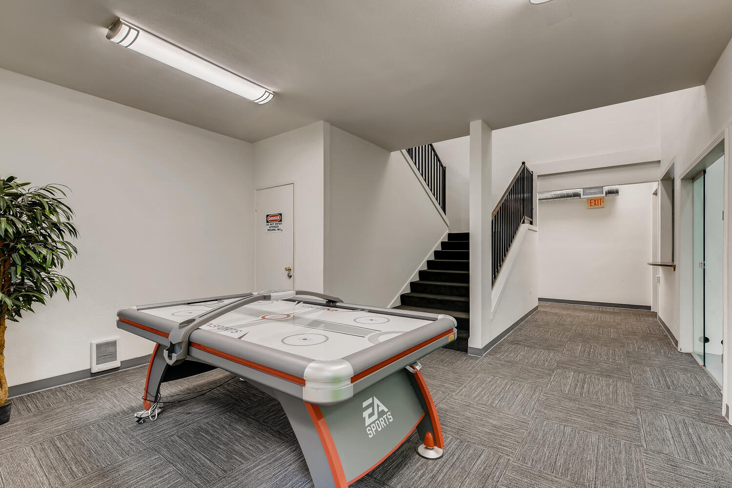 The Community Clubhouse with a Air Hockey Table at Morningtree Park Apartments