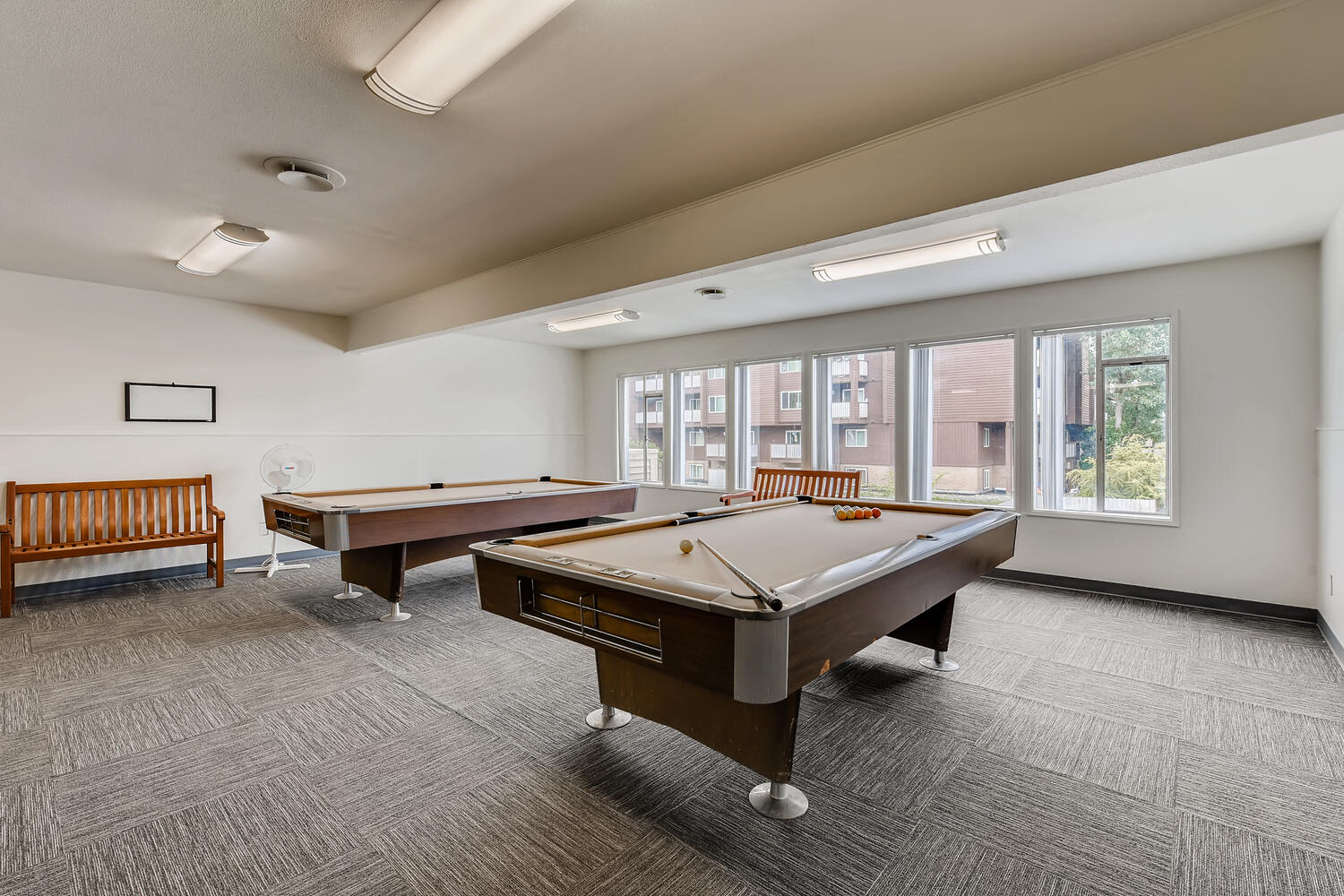 The Community Clubhouse with a Pool Table at Morningtree Park Apartments