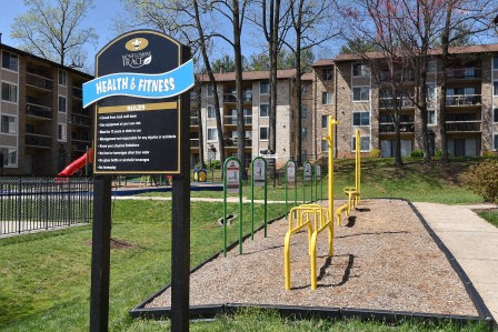 a playground in front of an apartment building