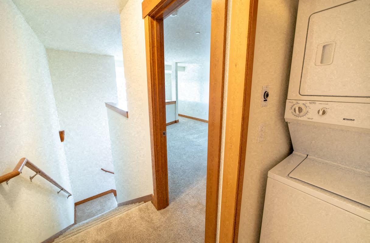 a laundry room with a washer and dryer in a house