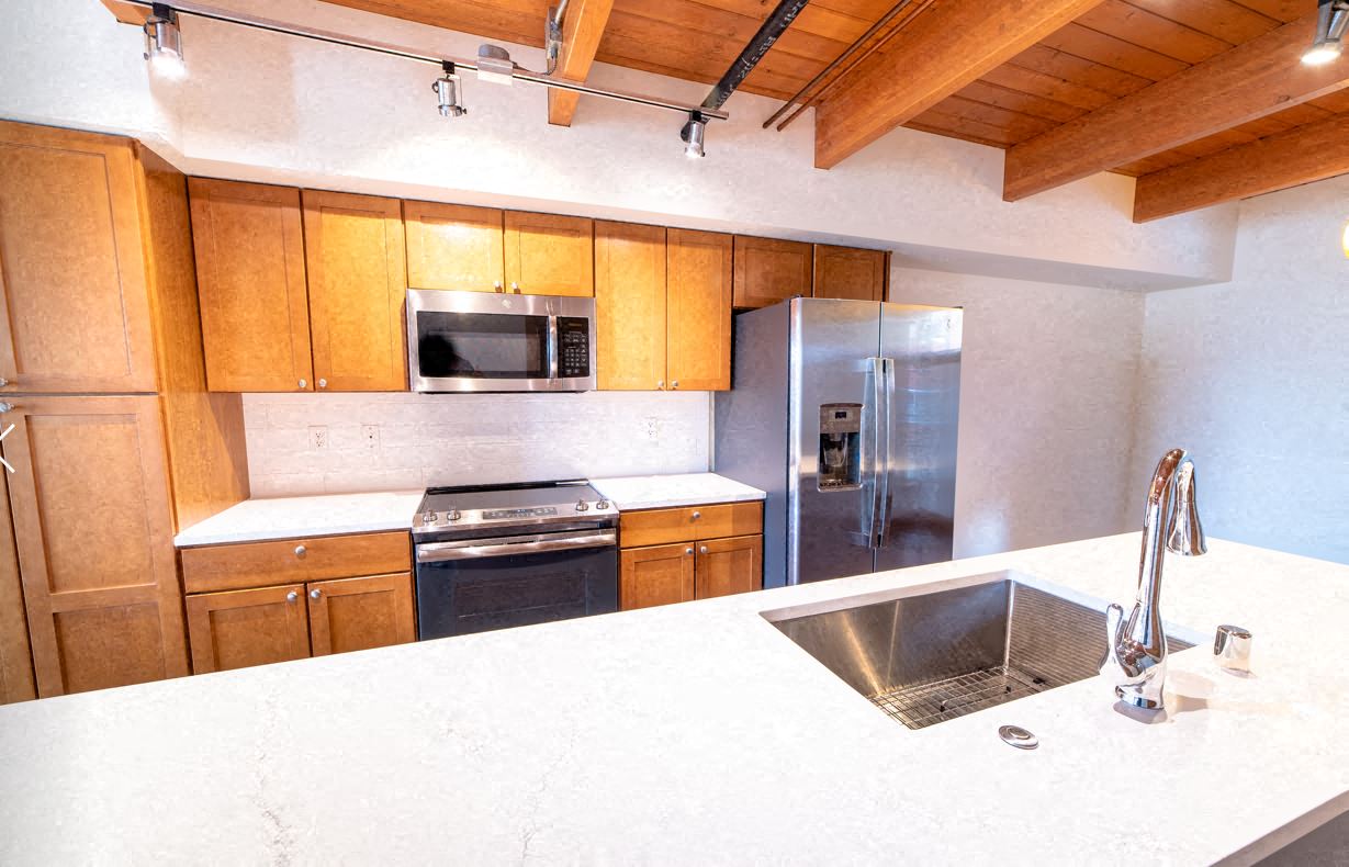 a kitchen with a counter top and a sink