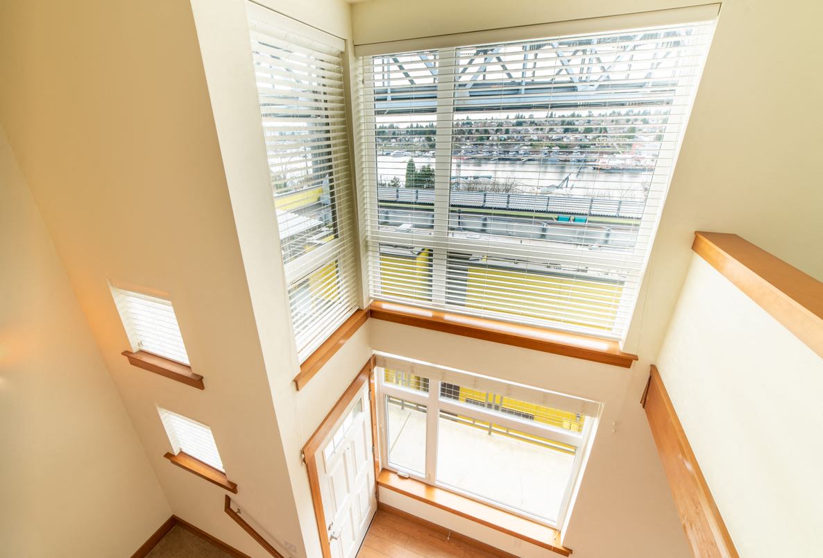 a view of a stairway with large windows