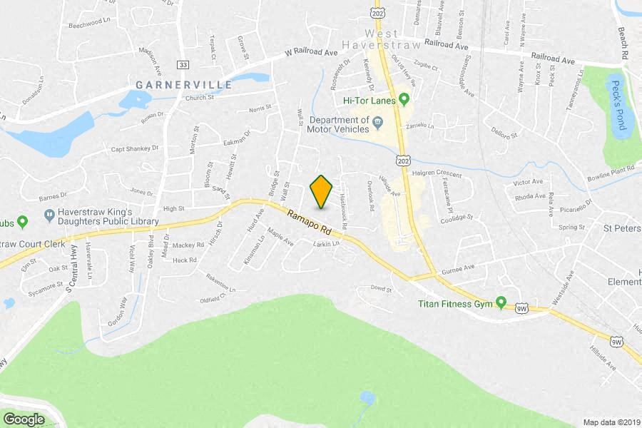 a map of a city with a yellow arrow on it