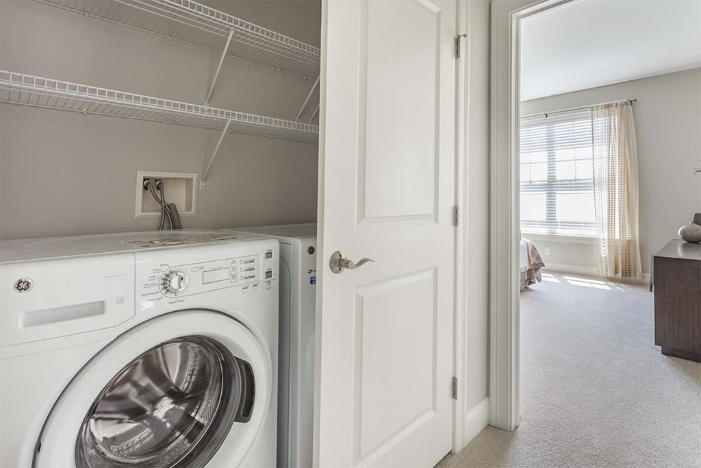 a white washer and dryer in a laundry room