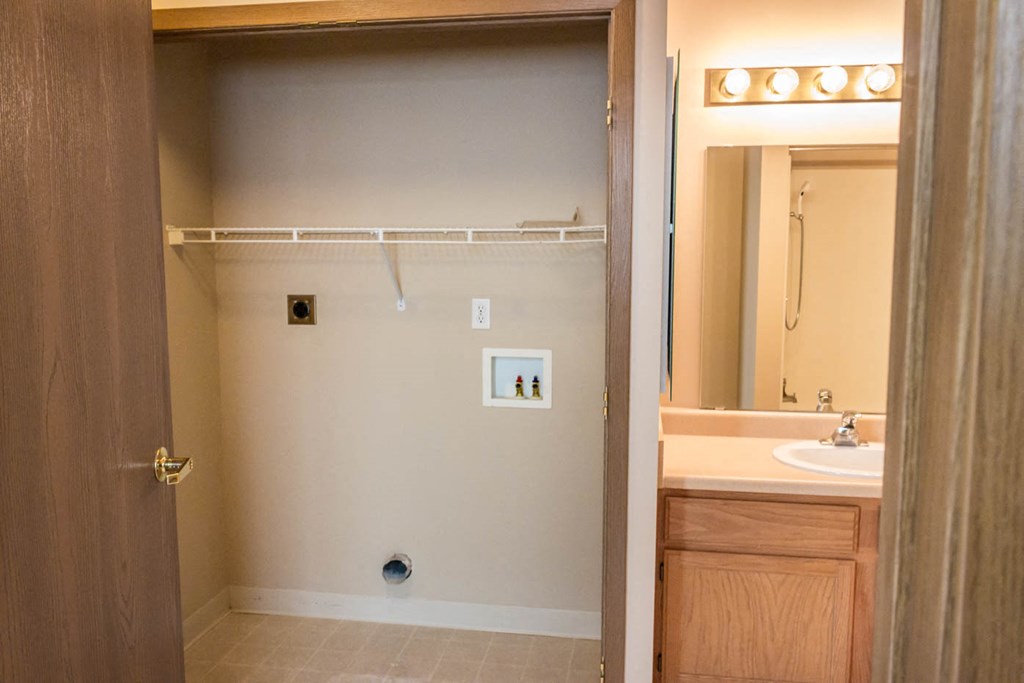 a bathroom with a shower and a sink and a mirror