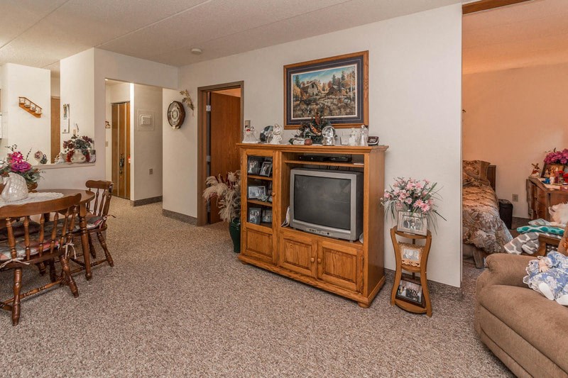 a living room filled with furniture and a television