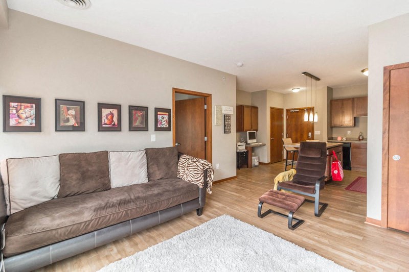 a living room with a couch and a chair