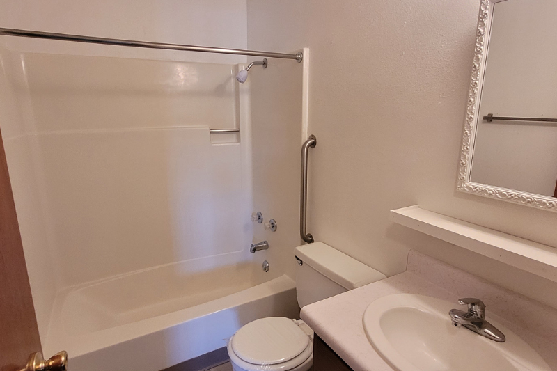 a bathroom with a sink toilet and a bath tub
