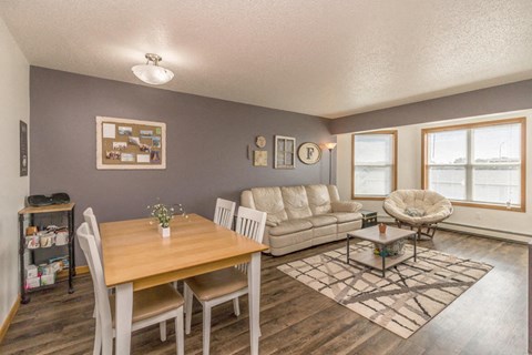 a living room and dining room with a couch and a table