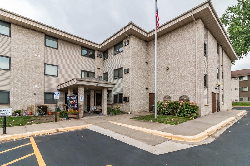 a large building with an flag in front of it