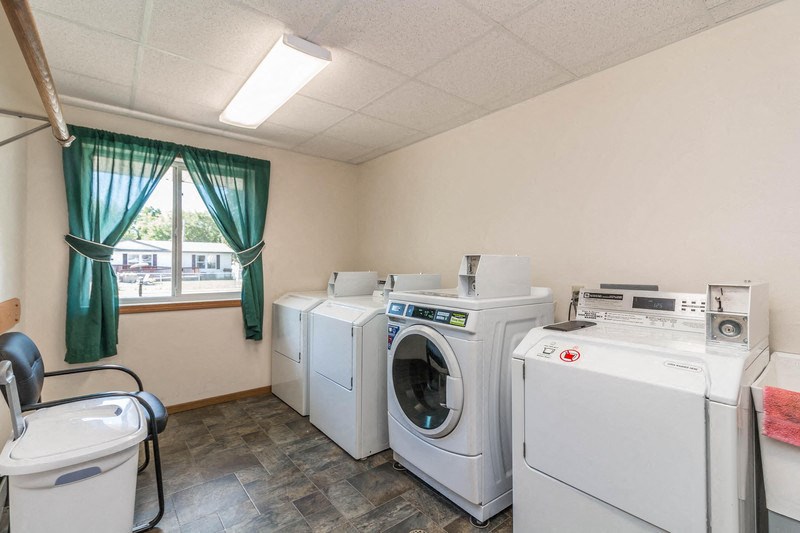 a laundry room with washes and washing machines in it