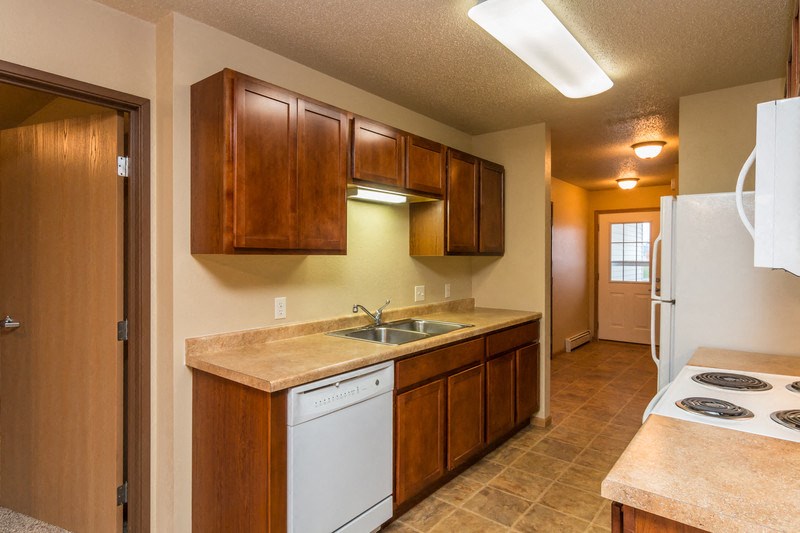 a kitchen with a stove and a sink