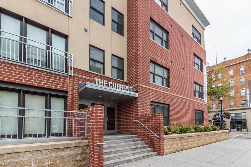 a brick building with a sign on the front of it