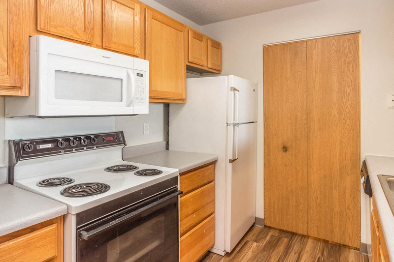 a kitchen with a stove microwave and refrigerator