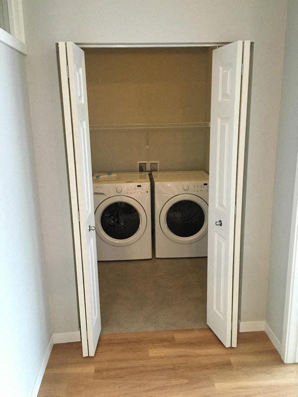 a laundry room with two washing machines in it