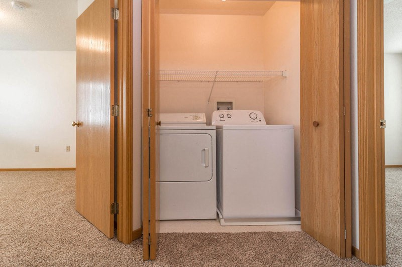 a laundry room with a washer and dryer in it