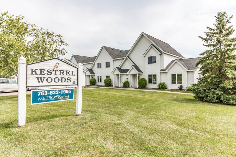 the estates sign in front of a house
