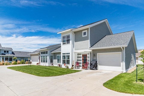 a house with a garage and a driveway in front of it