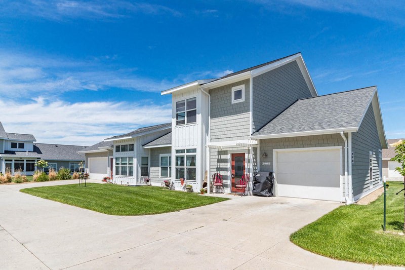 a house with a garage and a driveway in front of it
