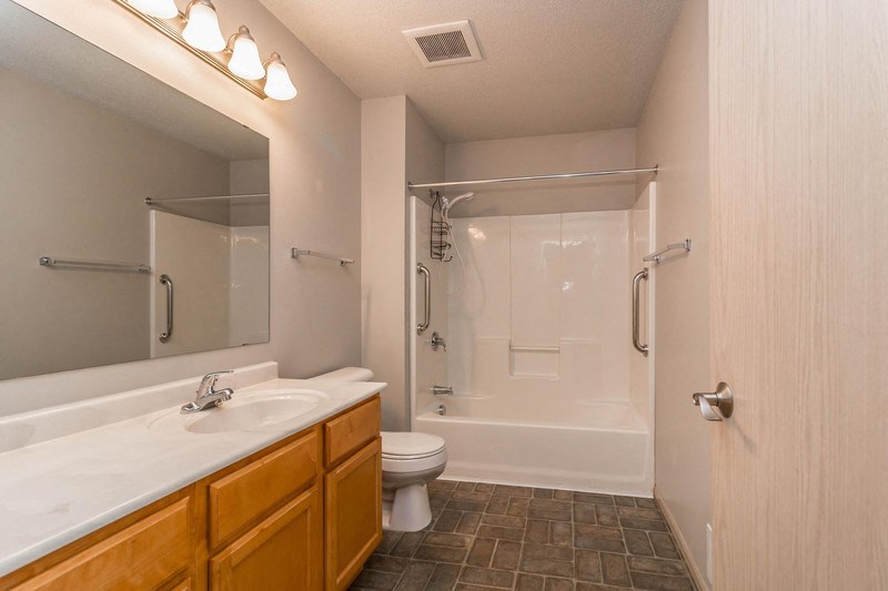 a bathroom with a sink toilet and a shower