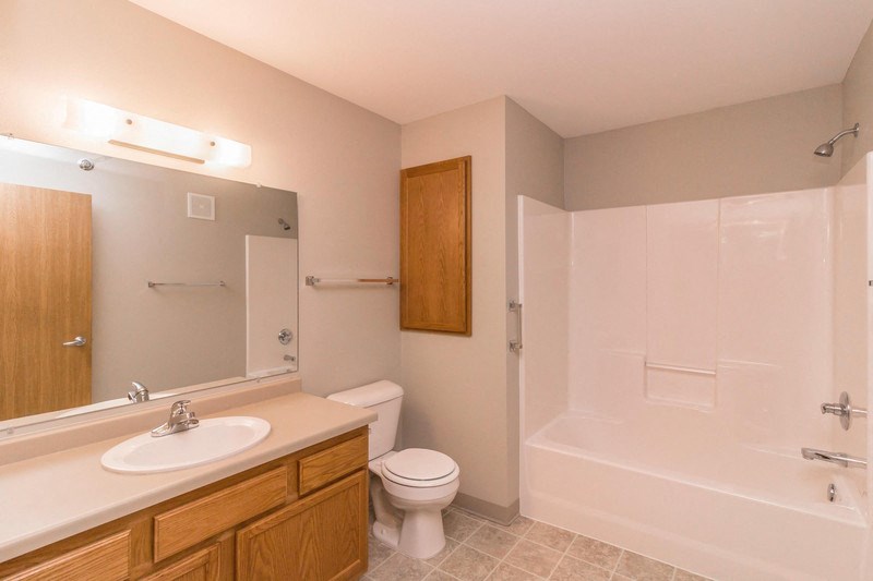a bathroom with a sink toilet and a bath tub