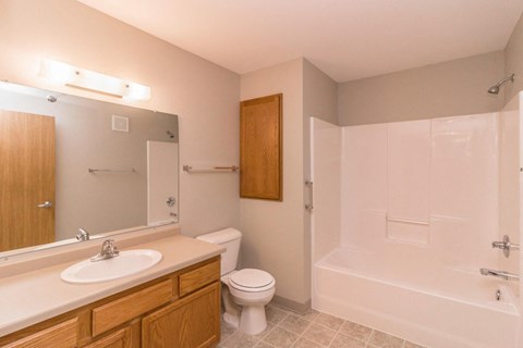a bathroom with a sink toilet and a bath tub