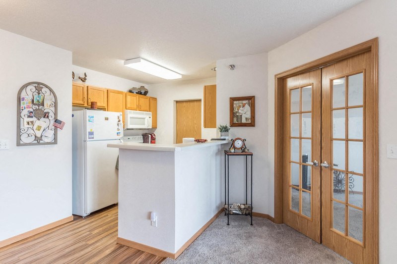 a kitchen with a counter top and a refrigerator