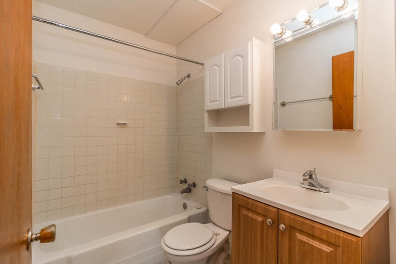 a bathroom with a sink toilet and a bath tub