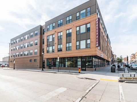 a large brick building on the corner of a street