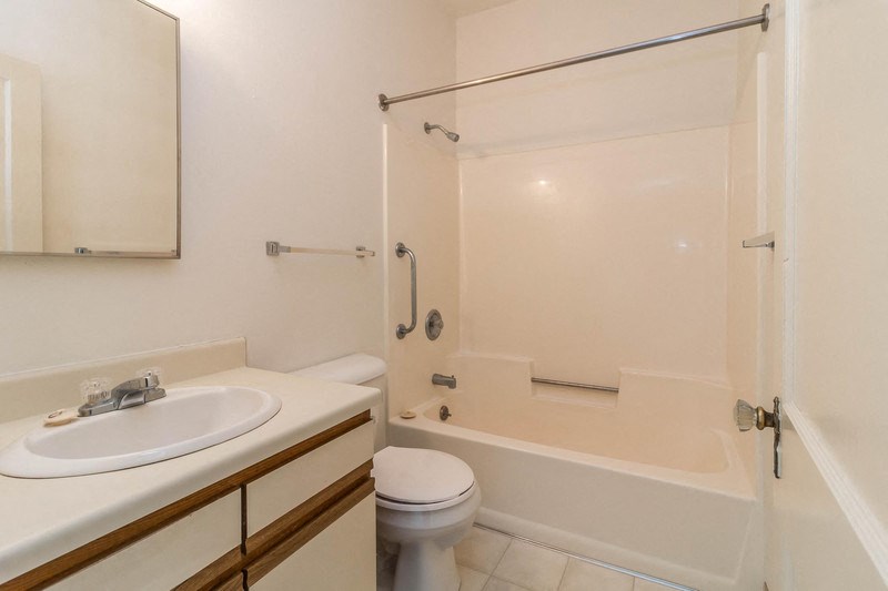 a bathroom with a sink toilet and a tub