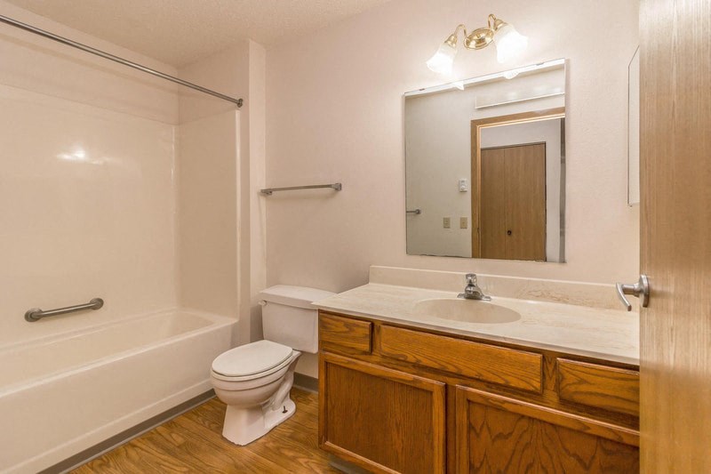 a bathroom with a sink toilet and a bath tub