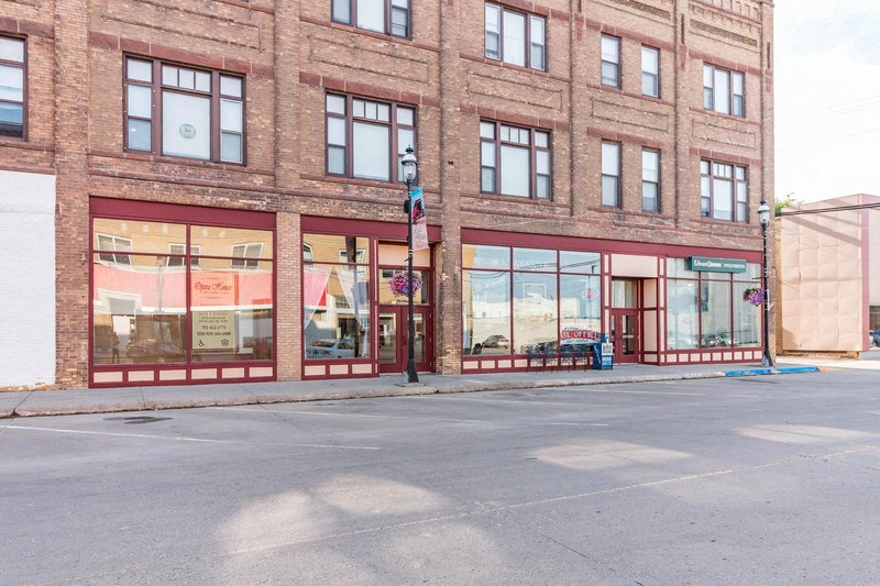 the front of a brick building on a city street