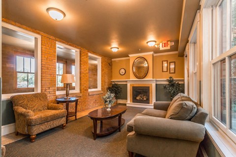 A living room with a fireplace and a couch.