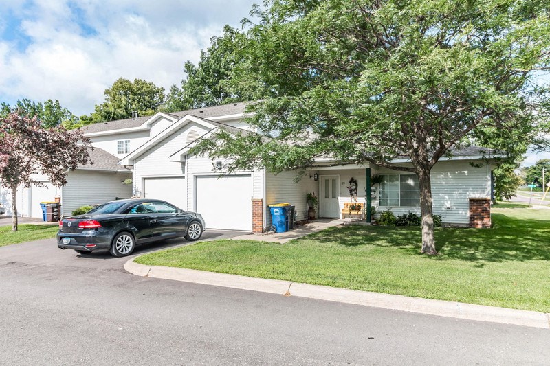a house with a car parked in the driveway