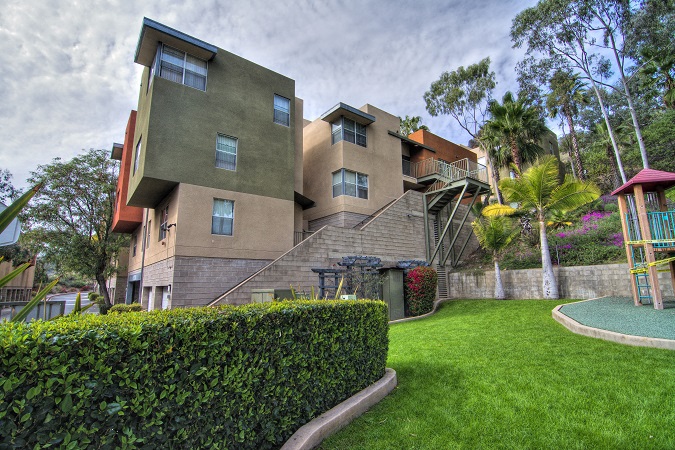 a large house with a yard and a staircase