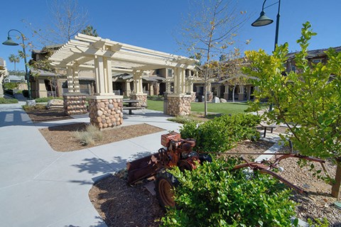 a courtyard with a pavilion and a fire hydrant in front of a building
