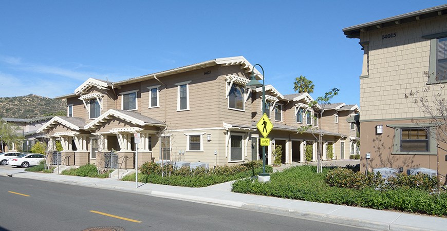 a row of houses on the side of a street