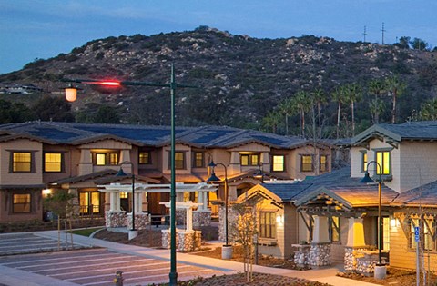 a row of houses with a mountain in the background