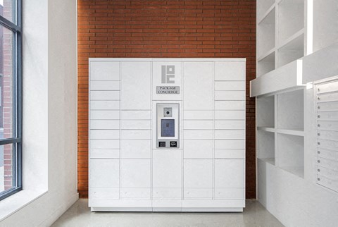 a vending machine in a room with a brick wall