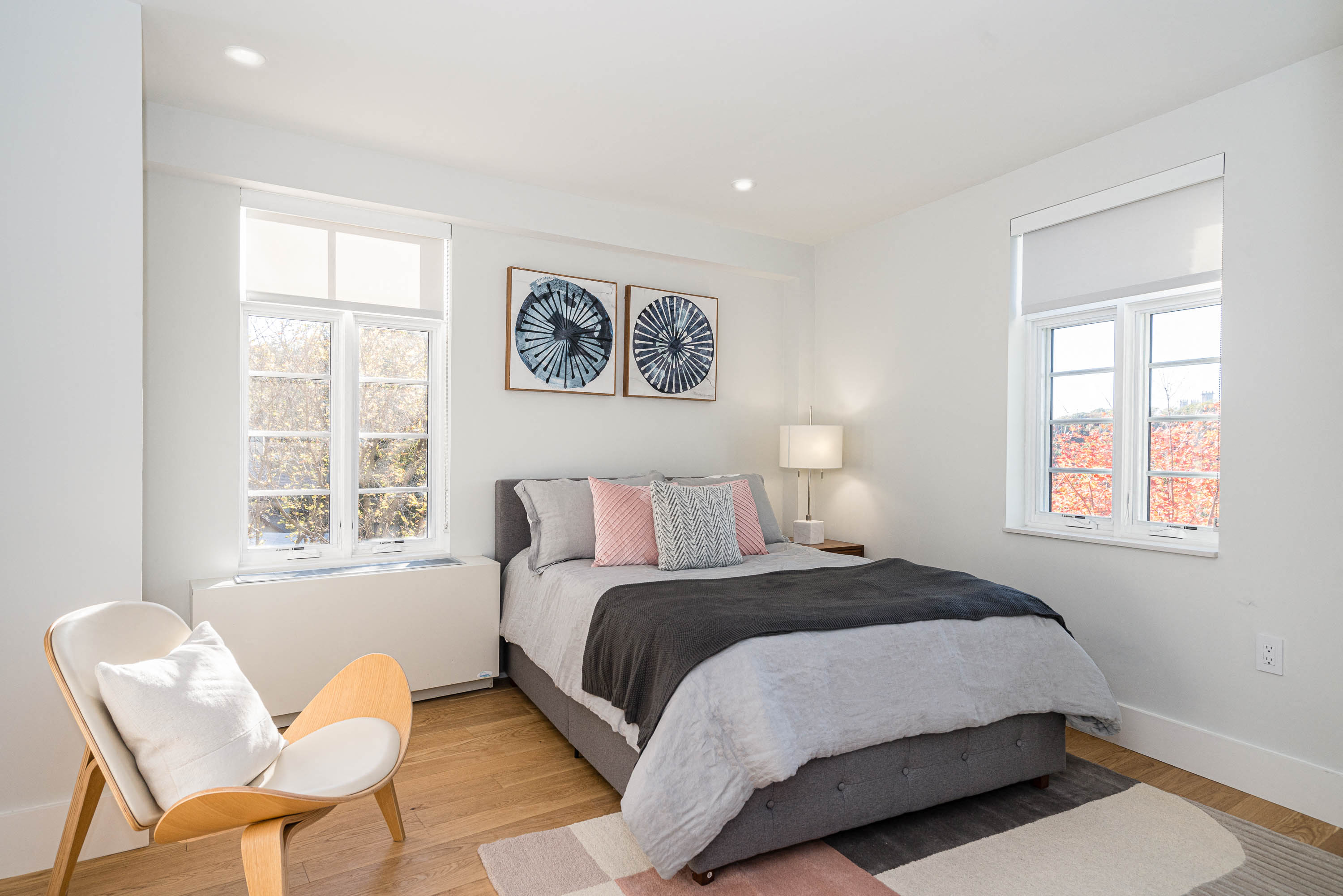 bedroom with hardwood floors and great natural light