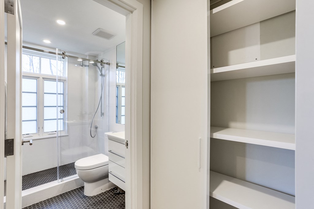 a renovated bathroom with a shower toilet and sink