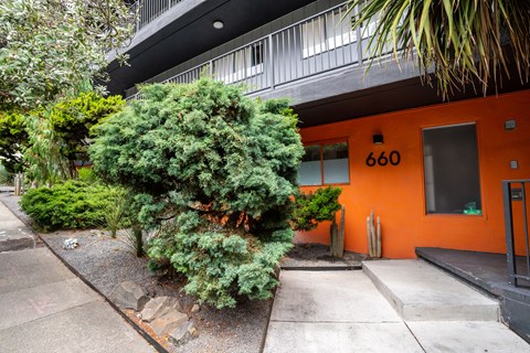 A bright orange building with the number 660 on it.