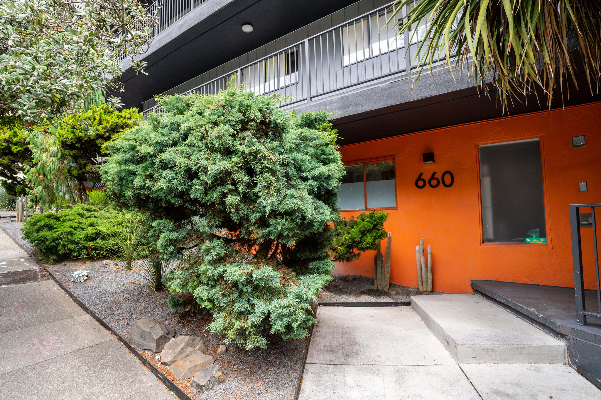 A bright orange building with the number 660 on it.